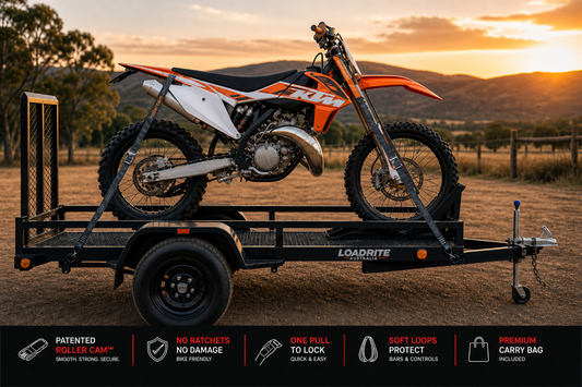 Rollercam Moto straps securing dirt bike to trailer for transport